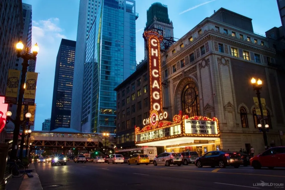 The Chicago Theatre sign lit up at dusk
