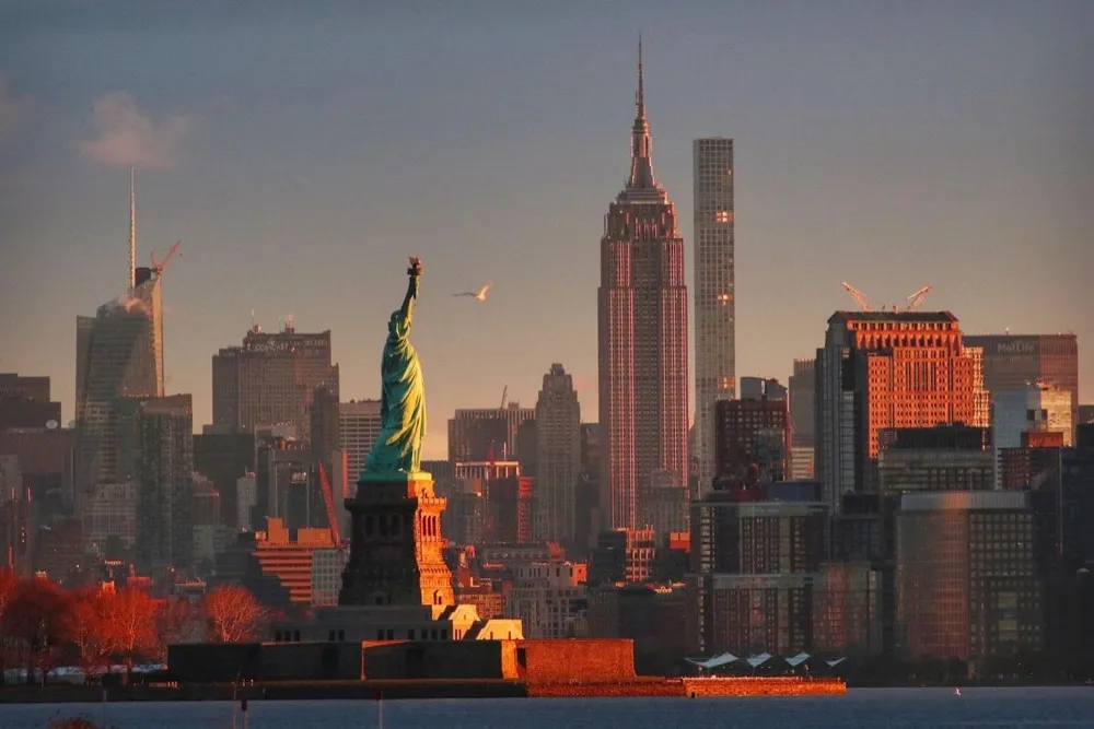 The Statue of Liberty in front of the Manhattan skyline